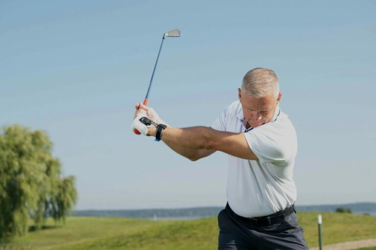 golf player on course wearing hackmotion and ready for shot
